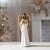 Elevate your holiday décor with this Angel Figurine with Harp and Gold Wings, a graceful statement piece that brings...
