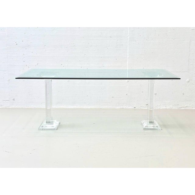 The design follows the typical style of the 1980s, combining transparent materials, metallic accents, and geometric lines....