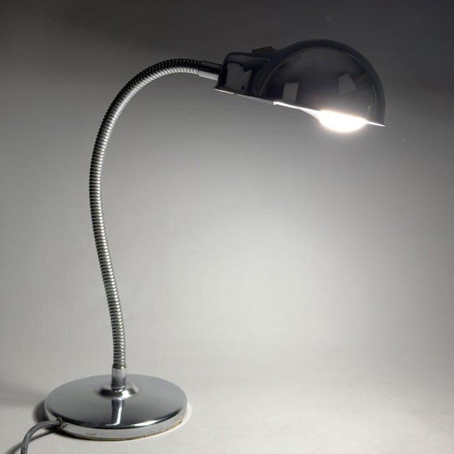 A splendid example of Italian designer lighting from the 1960s. An iconic table lamp, the perfect expression of Space Age...