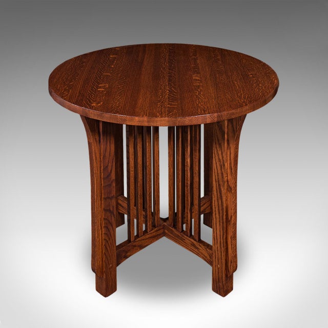 This is a vintage Cotswold School centre table. An English, oak occasional tea table, dating to the mid 20th century,...
