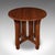This is a vintage Cotswold School centre table. An English, oak occasional tea table, dating to the mid 20th century,...