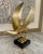 A large and impressive modern sculpture of a bird mounted on a custom marble base. We believe this piece to have been a...