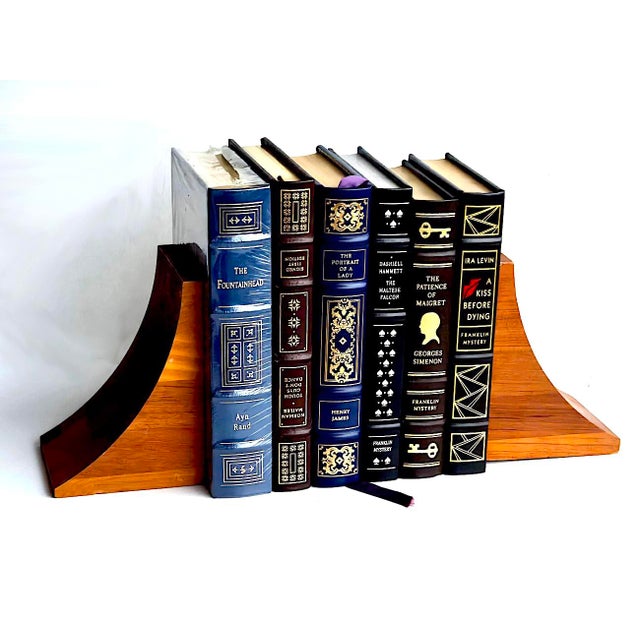Offered is a pair of vintage mid 20th Century Brostrom brand staved and lathed Teak wood bookends featuring a curved,...