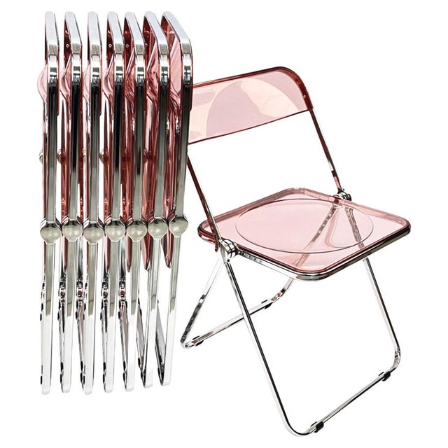 Original and signed set of 8 "Plia" pink with chrome frame folding chairs. This fantastic set was designed by Giancarlo...
