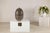 This large-scale artisan ceramic vase presents a refined, sculptural silhouette defined by its generous ovoid form and...