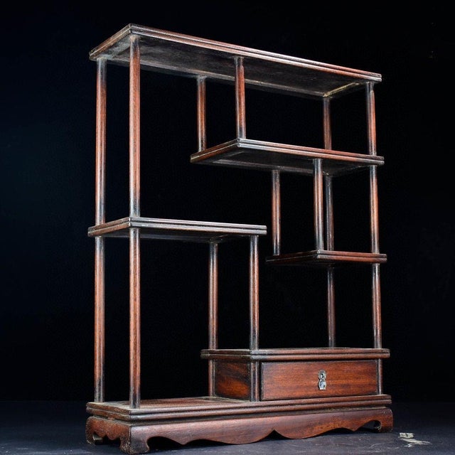 A beautiful and functional vintage Chinese display shelf, known as a "Bogujia" (博古架). Handcrafted from solid African...