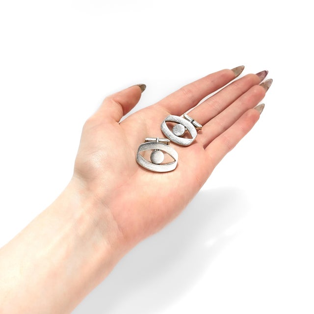 A fine pair of Mexican Modernist cufflinks. By Pedro Castillo. In sterling silver. In an oval form with negative space...