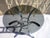 Black smoked glass dining table with chrome cabochons on a chromed steel base. The table is very stable and in excellent...