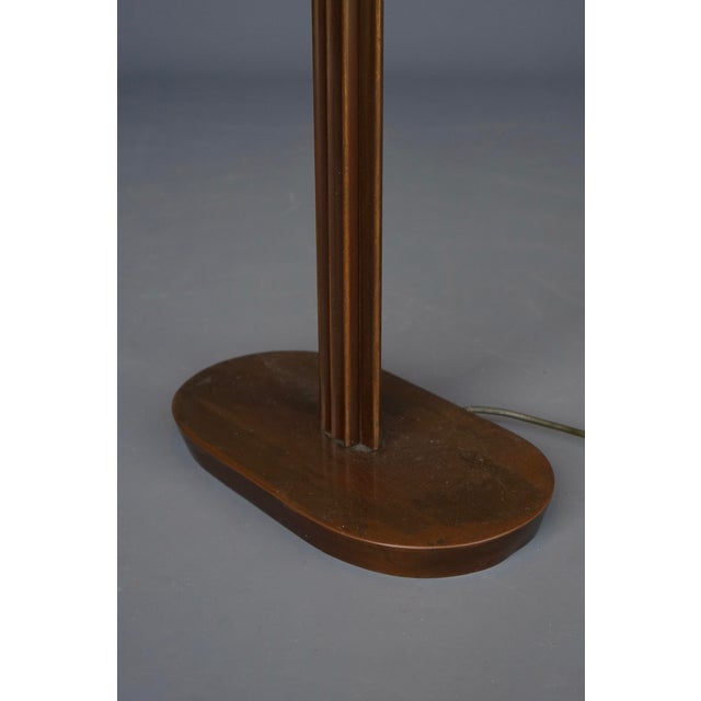 A beautifully made quality French floor lamp. Made circa 1950s-70s. It has a shaped stem and foot and its original...