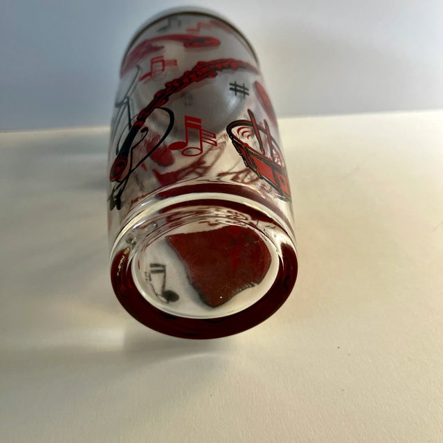 Wonderful Mid-Century glass cocktail shaker with musical instruments musical notes in red and black. Trumpet, clarinet,...