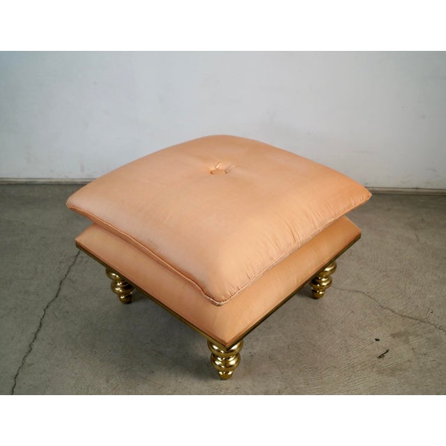 Vintage Hollywood Regency stool for sale. It's a very unique stool with solid brass turned legs, and a solid brass frame....
