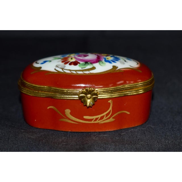 Vintage (1970's) Trinket/Keepsake Box Made by Limoges. The Box is Porcelain with Painted Floral Details. The Measurements:...