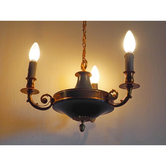 This is a genuine vintage item in good working order. It exhibits a beautiful, authentic patina on the brass surfaces that...