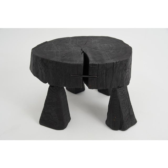 Chainsaw carved coffee table. Carved from a single piece of burnt oak wood and protected with the highest quality oils,...