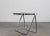 Platone folding table or desk with structure in chromed steel and die-cast aluminum, table top in black ABS. Designed by...