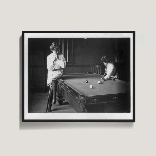Ships in 1–3 days. A 1903 photograph of two young women at a billiard table -- one perched on its edge with relaxed...