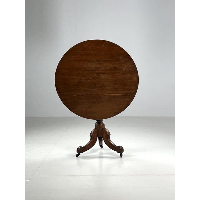 Very beautiful oak tilt top / folding table. Originally from England, 19th century. Stands on wheels. Condition is very...