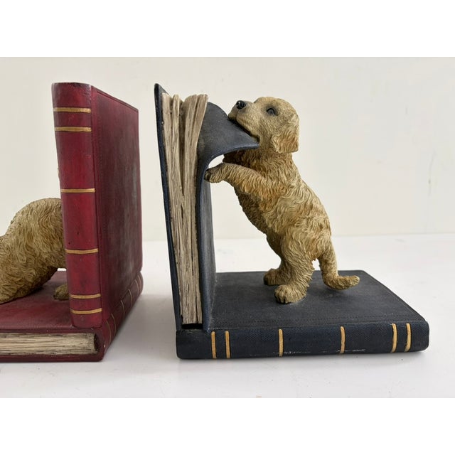 Vintage pair of golden retriever bookends with a realistic figural design. Made of heavy resin with a warm, aged finish...