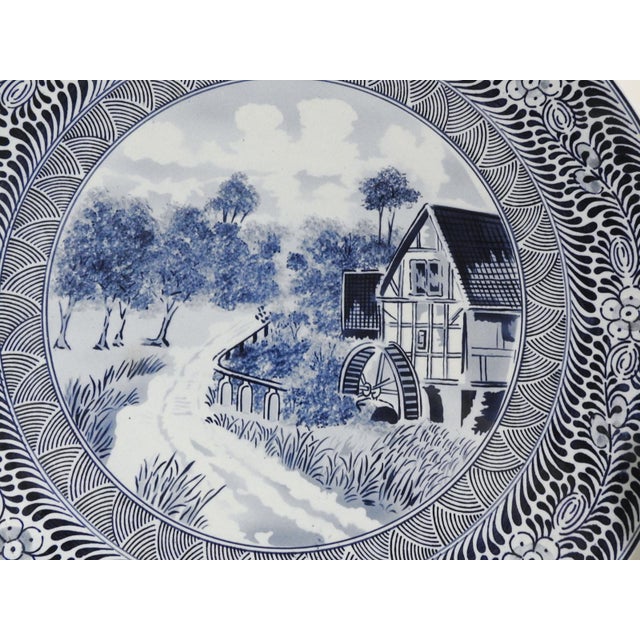 Mid 20th century Blau Holland Delft large decorative all plate. Waterwheel and mill scene with decorative border. Marked...