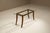 An elegant interplay of glass and carved wood, this coffee table brings together lightness and sculptural detailing in a...