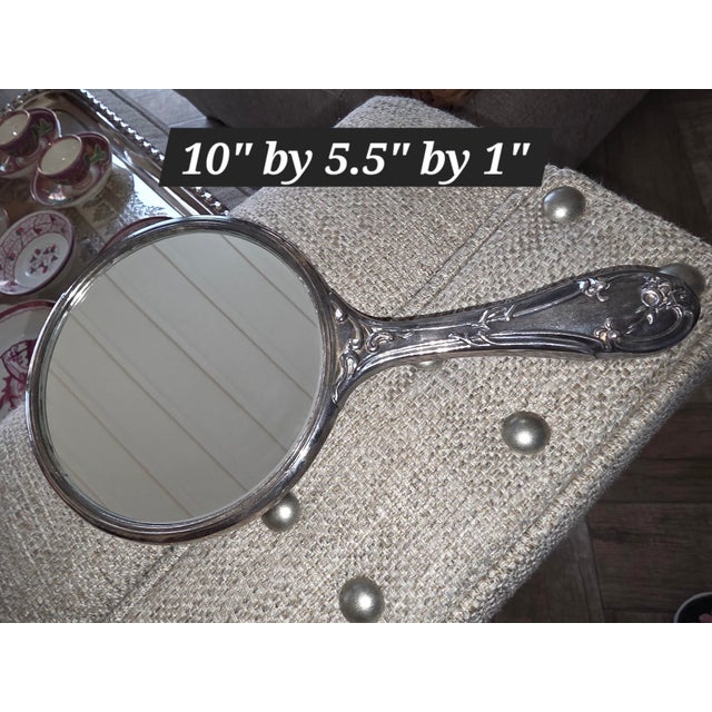 Pretty Circa 1900 hard mirror. It really looks like the sterling silver ones but its silver plated. This is very heavy and...