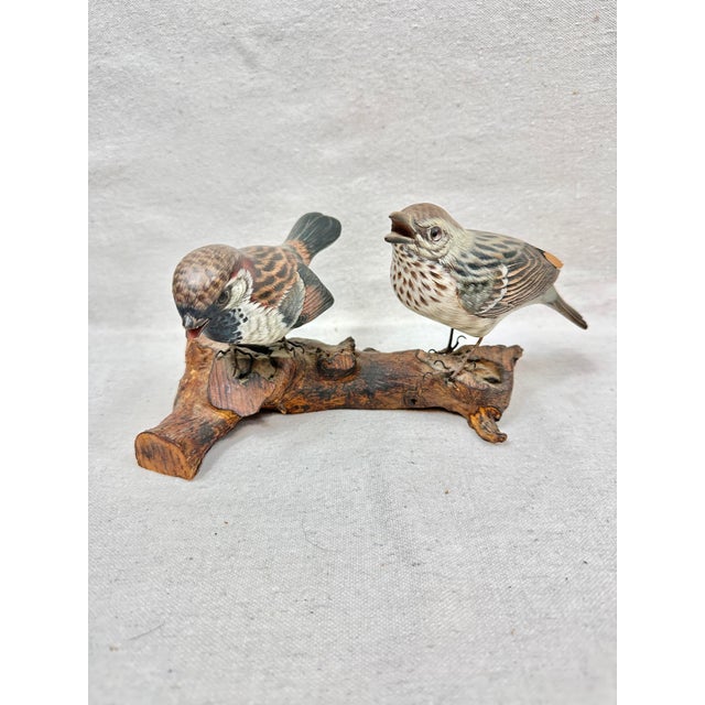Bring a touch of nature indoors with this charming, highly detailed folk art sculpture featuring a pair of hand-carved and...