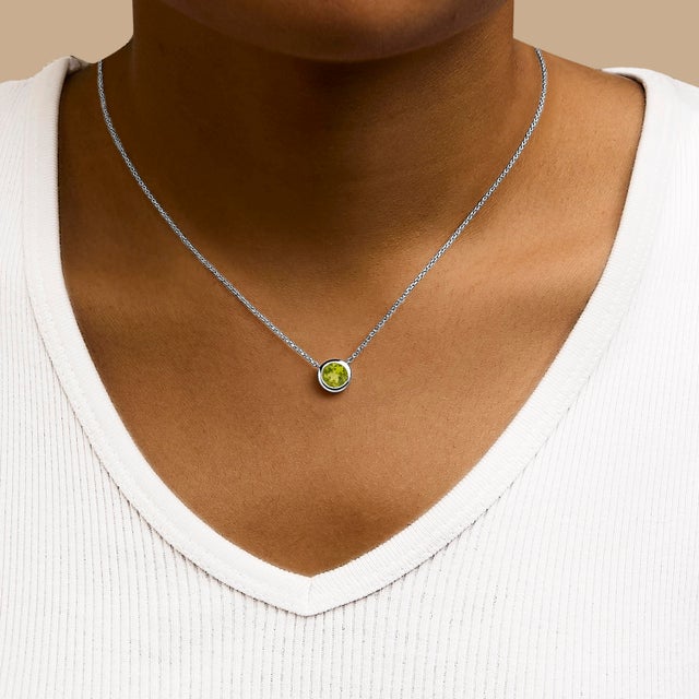 Imbued with captivating radiance, this exquisite pendant necklace combines the timeless allure of .925 sterling silver...