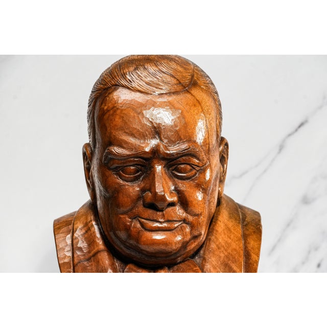 Celebrate one of history’s most iconic leaders with this striking hand-carved wood bust of Sir Winston Churchill, a...