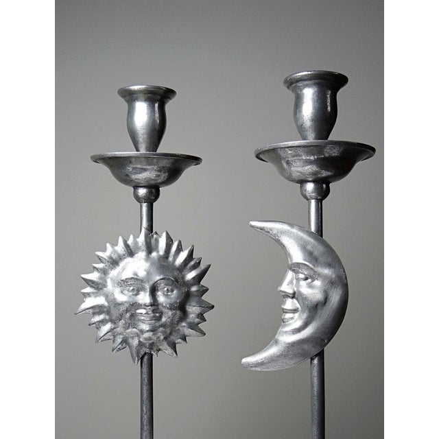 Pair of magnificent large candlesticks with celestial, anthropomorphic, solar, and lunar motifs, crafted from repoussé or...