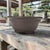 Chinese Yixing Zisha bonsai pot of circular form with an unglazed finish and impressed seal mark reading "9" dating most...
