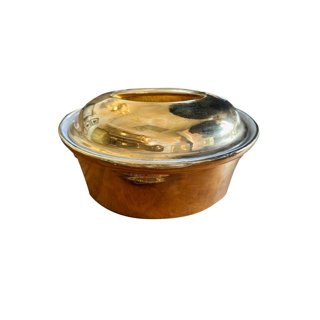 This classic porcelain casserole dish has a beautiful gold glaze on the exterior. The dish also has a matching lid. There...