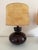 A pair of beautiful mid-century ceramic lamps in brown glaze with classic drum lampshades crafted from natural cork...