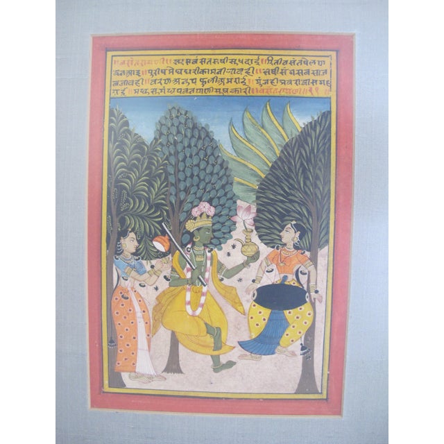 Antique Persian manuscript page with script and a finely detailed artwork in bright colors. Frame measures 12 1/4" x 15...