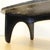 Mid century era black coffee table with a cultured marble kidney shaped top on a black wood base with 3 legs. Made in the...