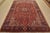 An authentic vintage traditional Heriz rug hand-knotted with fine wool and natural dyes. This rug features a central...