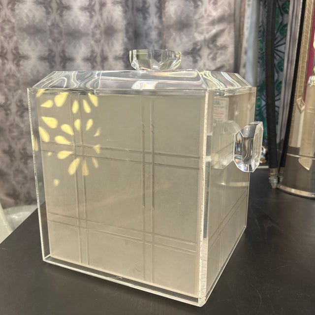 Wonderful vintage 1970s lucite and acrylic ice bucket. It has two faceted side handles and a beveled edge lid with a...