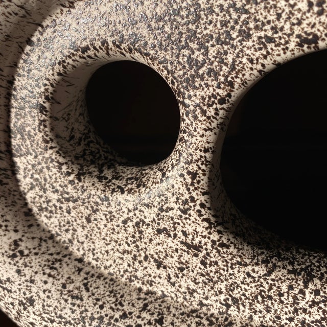 Mid-Century Japanese ceramic amorphic vase. Cream color with dark brown splattered paint motif. This style of vase is...