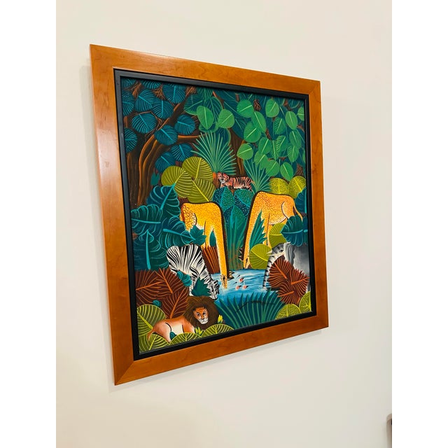 Haitian Jungle Scene Painting – Naïve Style This vibrant Haitian painting bursts with life and detail, capturing a lush...