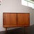 Crafted in Denmark by Omann Jun Møbelfabrik, this teak sideboard exemplifies the refined craftsmanship of mid-century...