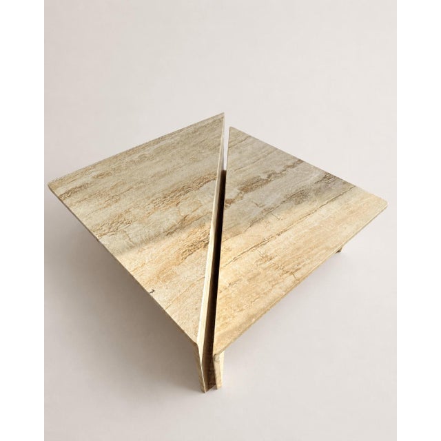 An exceptional pair of vintage Italian postmodern coffee tables. Crafted entirely from premium filled travertine, each...