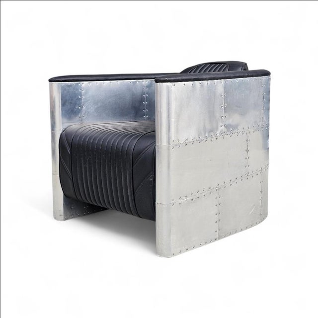 Aviator Chair in great condition. It has a leather seat and backrest, and screws instead of rivets. The armchair is in...