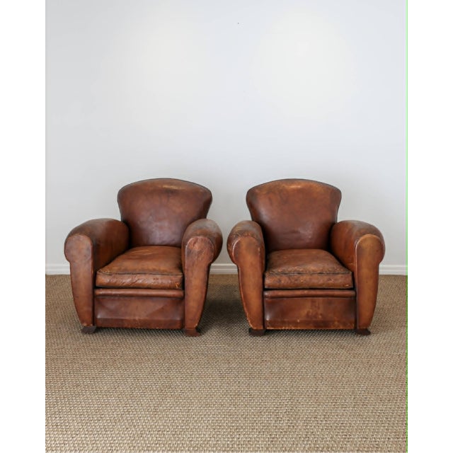 A beautiful and increasingly hard-to-find pair of authentic 1920’s French leather club chairs, rich with the character and...