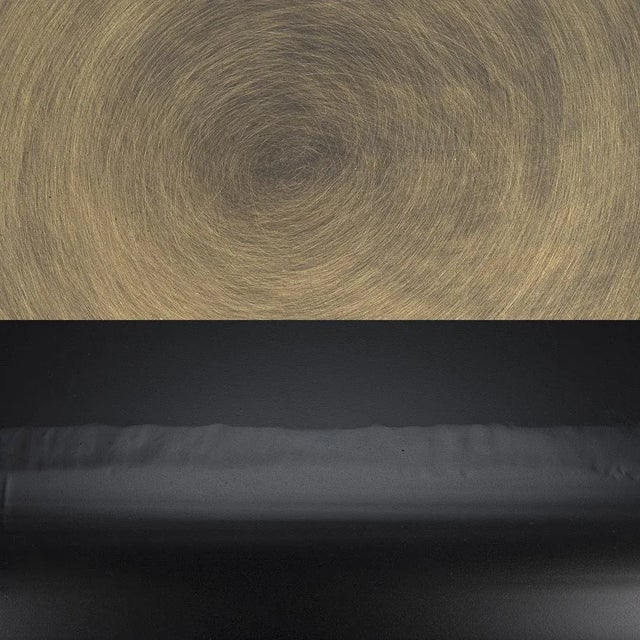 This metal accent table succeeds as either a featured item or a complementary piece.