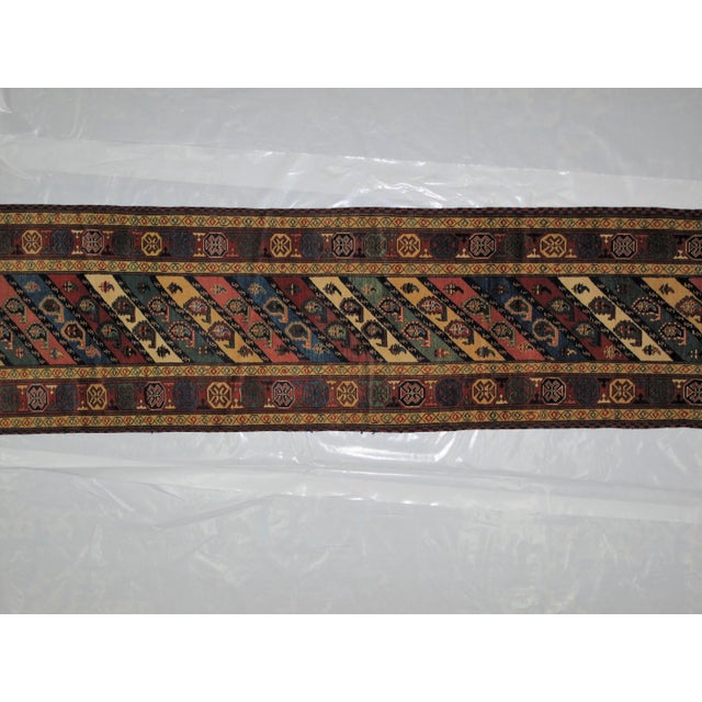 This masterpiece is a wool on wool pile genuine handwoven vegetable dye Chichi Kazak runner in mint condition. Thin pile.