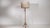 Tripod brass floor lamp in Antique Brass. Its antique brass finish sets off slender turned column, tripod base, a hallmark...