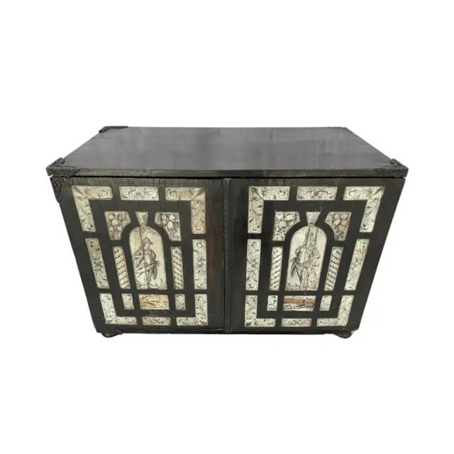 17th Century Italian Ebonized Inlaid Milanese Table Cabinet. Cabinet is an exceptional rectangular box-form cabinet...