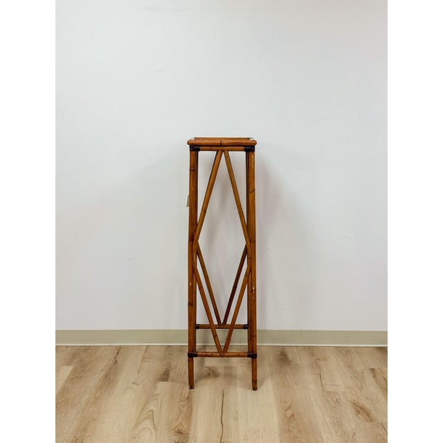 This tall bamboo plant stand brings an easy, coastal boho sensibility to any room, finished in a warm tone that highlights...