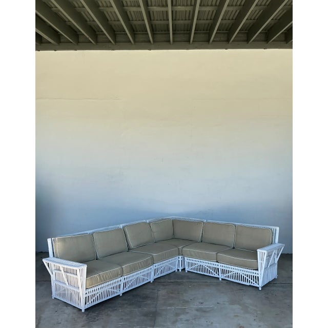 Showcasing grand proportions and airy architectural lattice construction, this four-piece vintage sectional sofa is...