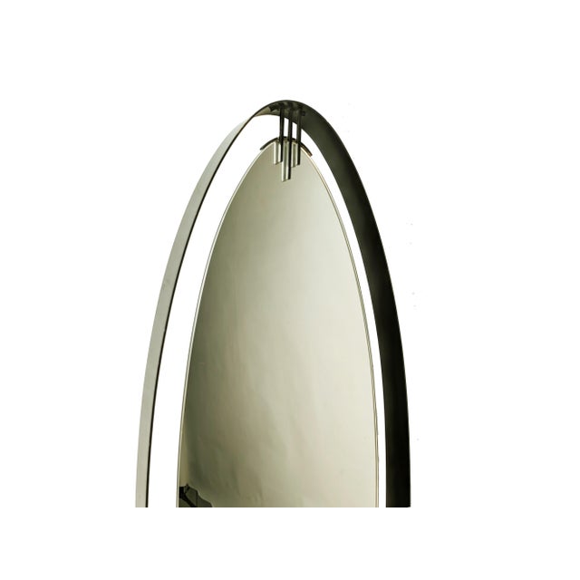 Fine oval wall mirror in painted brass, made by Santambrogio & De Berti in Italy in the early 1960s. The same company also...