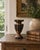 A sculptural vintage vase hand carved from chrysanthemum wood, distinguished by its deeply ridged body, scalloped edges,...
